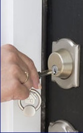 Locksmith opening a door lock